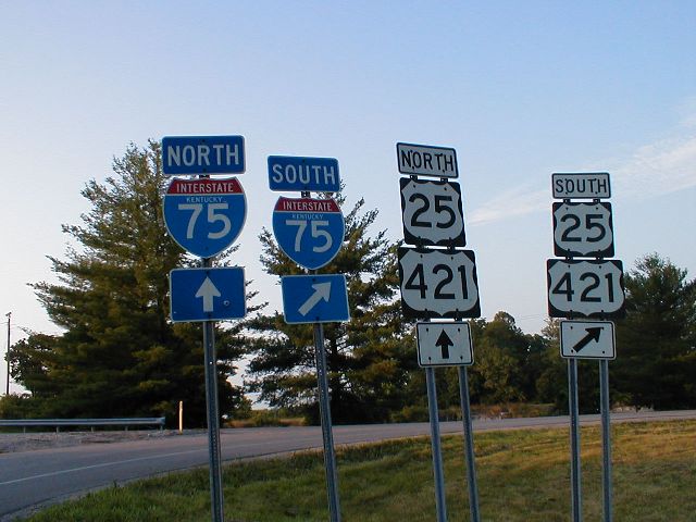 Signage for the I-75 interchange at the northern terminus of KY 2328. This is Exit 99 off of I-75.