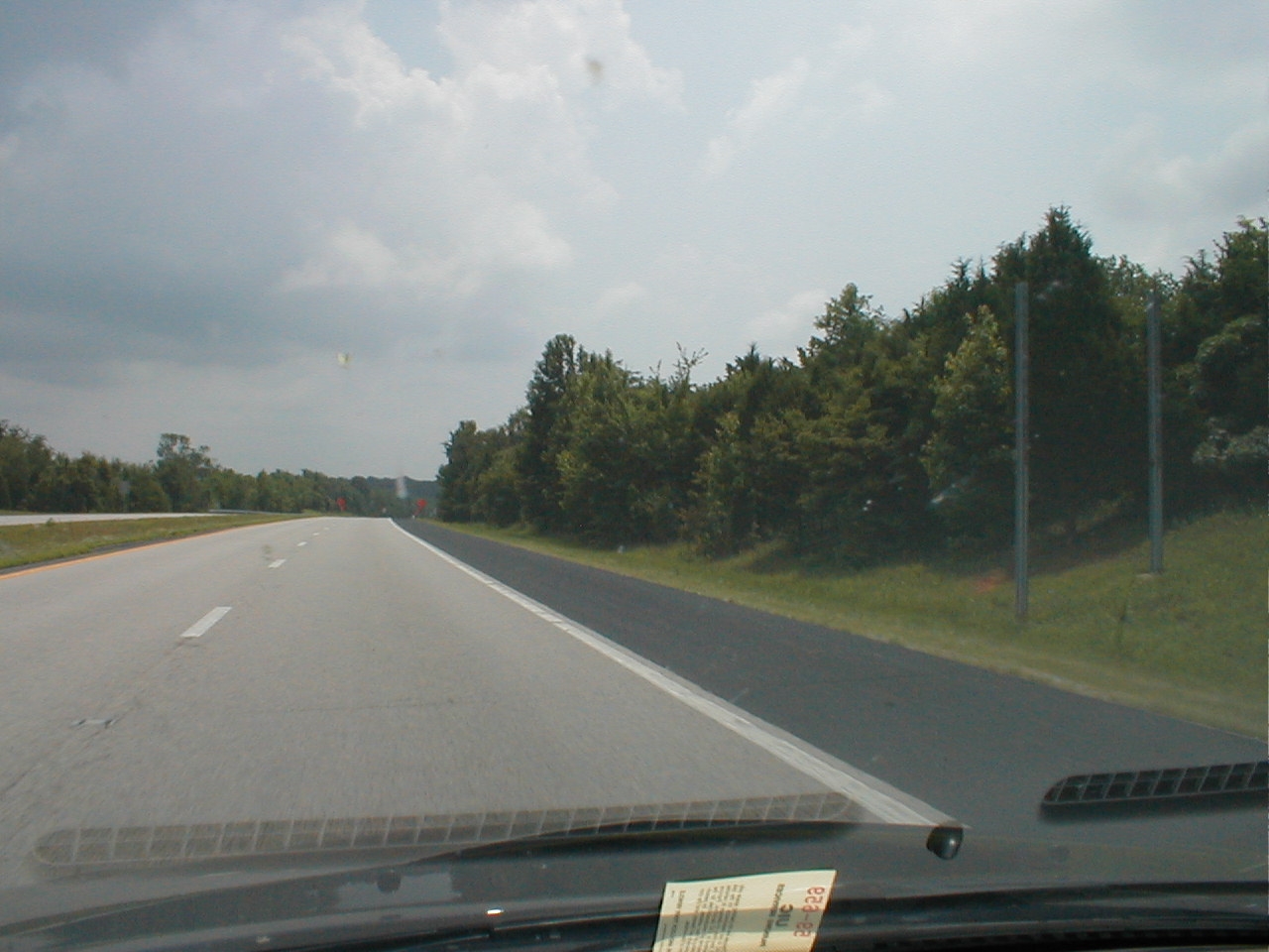 Empty sign posts mark the approach to the former toll booths at the western terminus.