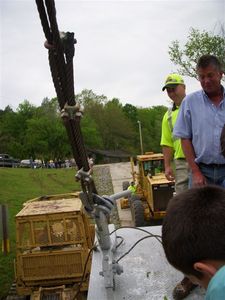 Shawn Massingille, KYTC foreman for Monroe County, and Joe Stephens react as the Sloan is christened with a bottle of champagne.