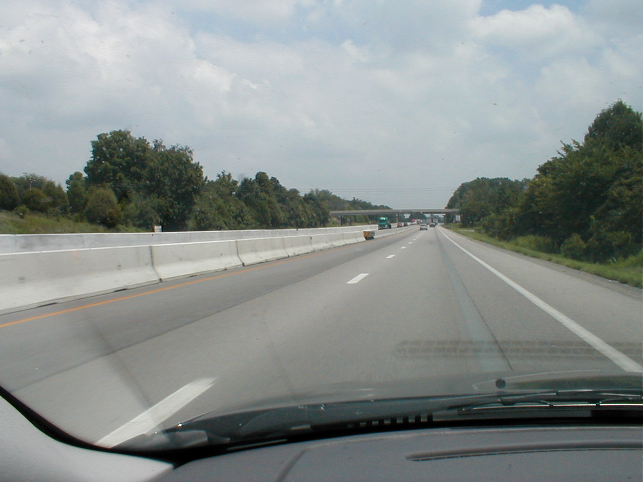 Shows the temporary barrier separating the north and south bound lanes and the permanent barrier which currently separates the south bound lanes.