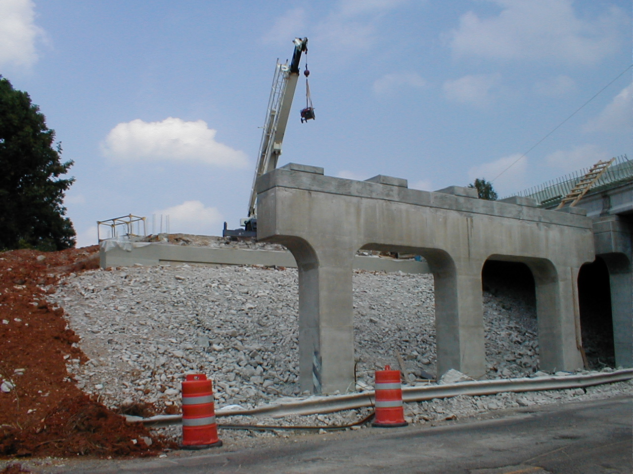 Shows where the old roadbed has been removed and a new roadbed is being built.