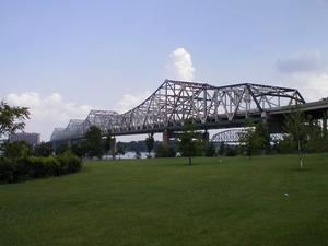 The I-65 John F. Kennedy Bridge over the Ohio River at Louisville viewed from Louisville's Waterfront Park. The bridge in the background is the "Big Four" railroad bridge.