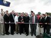 Kentucky Gov. Patton and Indiana Gov. O'Bannon cut a ribbon marking the official dedication of the bridge.
