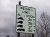 Regulatory sign describing weight restrictions for a bridge along US 68.